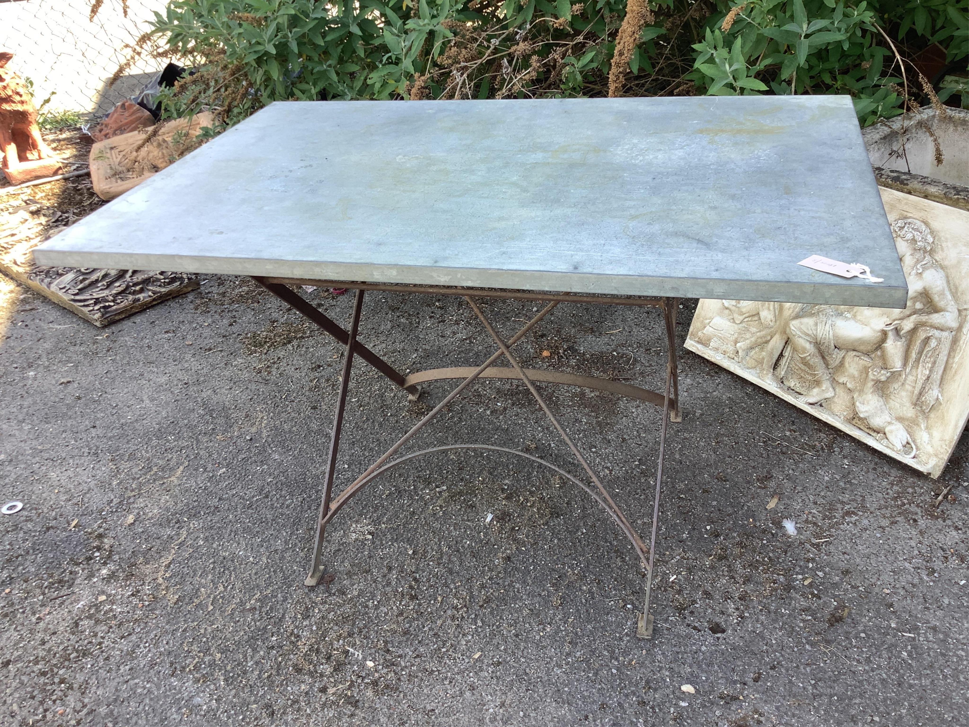 A rectangular zinc topped wrought iron garden table, width 120cm, depth 80cm, height 70cm